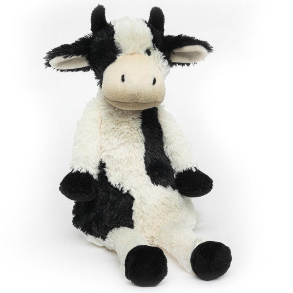 Plush cow toy with black and white pattern on a white background