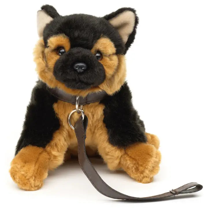 Plush German Shepherd dog toy with a leash on a white background