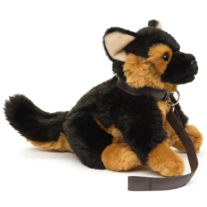 Plush German Shepherd dog toy with a leash on a white background